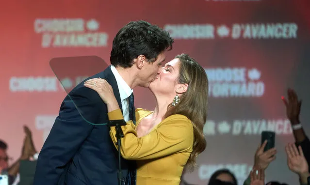 Canadian Prime Minister and Liberal Party leader Justin Trudeau (L) and wife Sophie Gregoire (R) kiss as they celebrate election victory in Montreal, Quebec, Canada, 21 October 2019. Liberal Party leader Justin Trudeau has retained his position as Canadian Prime Minister in the federal election but will be forced to form a minority government. (Photo by Valerie Blum/EPA/EFE)