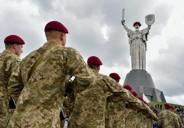 Soldiers in Kiev, Ukraine, march past the Motherland monument on May 9, 2017. (Photo by Mykola Lazarenko/TASS)