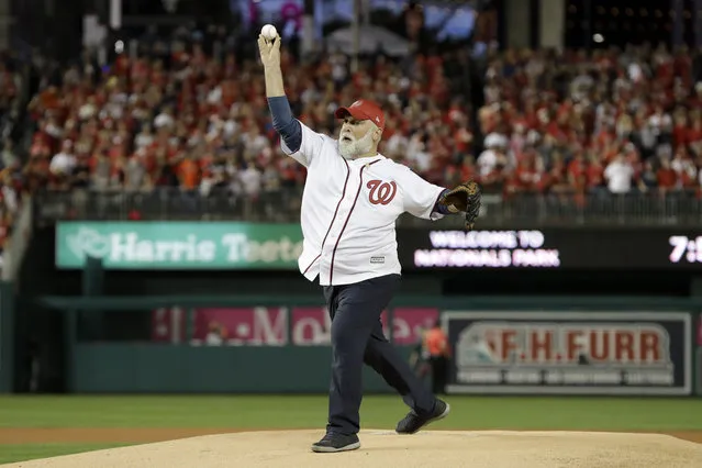 Chef, Jose Andres throws out the first pitch before Game 5 of the baseball World Series between the Houston Astros and the Washington Nationals Sunday, October 27, 2019, in Washington. (Photo by Jeff Roberson/AP Photo)