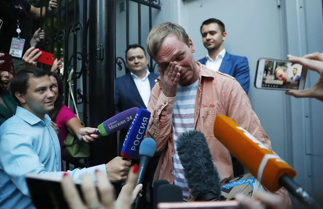 Prominent Russian investigative journalist Ivan Golunov, cries as he leaves a Investigative Committee building in Moscow, Russia, Tuesday, June 11, 2019. In a surprising turnaround, Russia's police chief on Tuesday dropped all charges against a prominent investigative reporter whose detention sparked public outrage and promised to go after the police officers who tried to frame the journalist as a drug-dealer. (Photo by Pavel Golovkin/AP Photo)