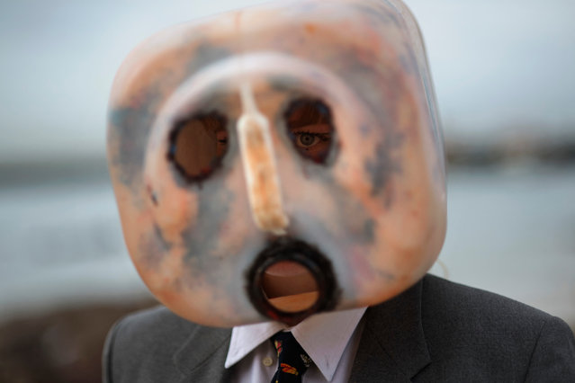 An activist dressed up as an evil oil executive takes part in a protest organised by Extinction Rebellion to call for a permanent ban on oil exploration in Antarctica as part of World Environment Day in Cape Town on June 5, 2023. (Photo by Rodger Bosch/AFP Photo)