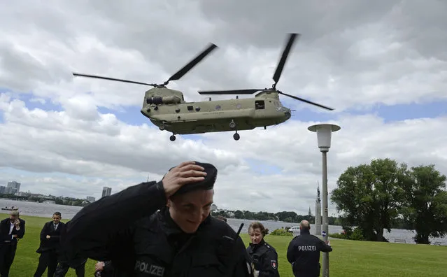 A helicopter of the U.S. Army starts during a joined drill of the US Army and the federal police on the occasion of the upcoming G-20 Summit at the Alster river in Hamburg, Germany, Tuesday, July 4, 2017. (Photo by Daniel Reinhardt/DPA via AP Photo)