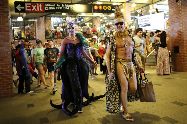 Participants of the Mermaid Parade arrive in a subway station in Brooklyn, New York June 18, 2016. (Photo by Eduardo Munoz/Reuters)