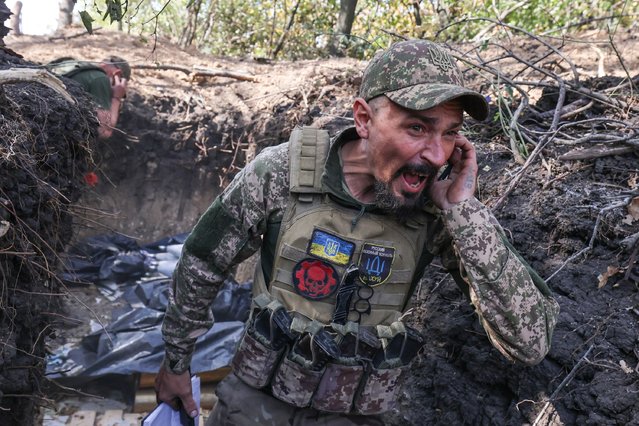 Artem, a 40-year-old Ukrainian commander, shouts a warning before his artillery team fires toward Russian positions near Pokrovsk in early October 2024. (Photo by Serhiy Nuzhnenko/Radio Free Europe/Radio Liberty)