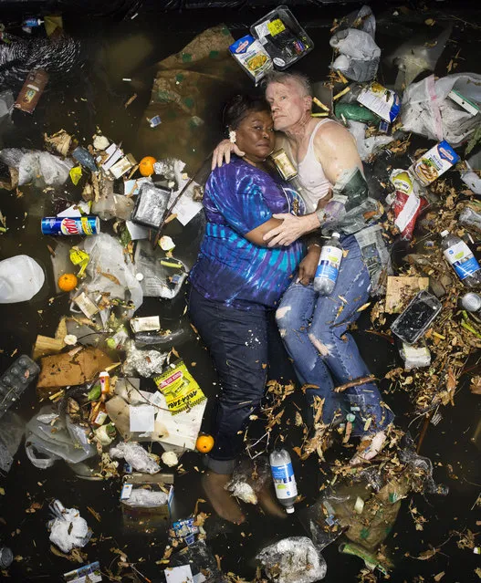 Marsha and Steve surrounded by seven days of their own rubbish in Pasadena, California. (Photo by Gregg Segal/Barcroft Media)