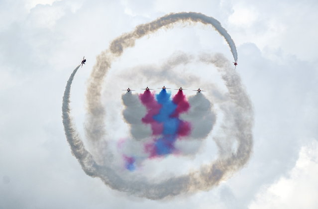 Aircraft from the British Royal Air Force (RAF) Aerobatic Team, the Red Arrows perform during the Danish Air Show at Karup Airport, near Karup, Denmark, 19 June 2022. (Photo by Henning Bagger/EPA/EFE)