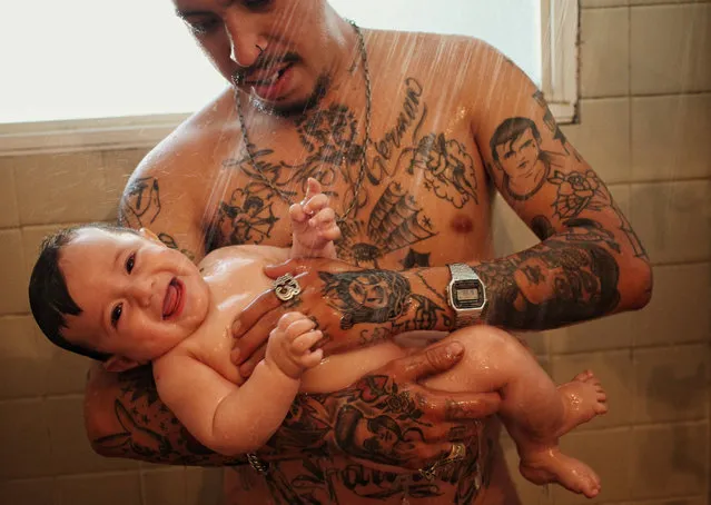 Luis Garcia bathes his son  in Mexico City, Mexico, 17 June 2017. As Mexico celebrates Father’s Day, Garcia has has embraced a more hands-on approach to paternity as his wife holds down a job at a local company. Despite roadblocks in the wage gap, sexism and cultural mores many Latin American men are adopting new paternal roles according to the 'State of Paternity Report in Latin America and the Caribbean 2017. (Photo by Sashenka Gutierrez/EPA)