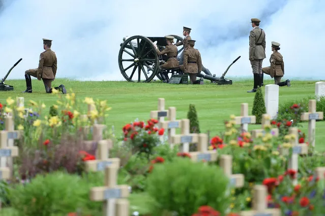 Men and women dressed as World War I (WWI) soldiers load a cannon as they take part in a memorial ceremony at the Franco-British National Memorial in Thiepval near Albert, during the commemorations to mark the 100th anniversary of the start of the Battle of the Somme, northern France, July 1, 2016. (Photo by Stephane de Sakutin/Reuters)