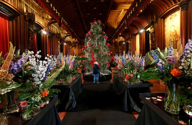 A floral display is pictured inside the Gothic room of Brussels' town hall during “Flowertime” event in Brussels, Belgium August 11, 2017. (Photo by Francois Lenoir/Reuters)