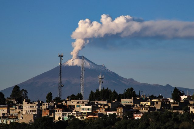 The Popocatepetl volcano releases a plume of gas and ash as seen from the town of San Hipolito Chimalpa in Tlaxcala, Mexico, on October 23, 2024. (Photo by J. Guadalupe Perez/AFP Photo)