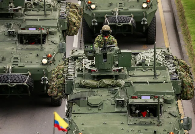 Soldiers pass by in a military vehicle during a military parade to celebrate the 206th anniversary of Colombia's independence in Bogota, Colombia, July 20, 2016. (Photo by John Vizcaino/Reuters)