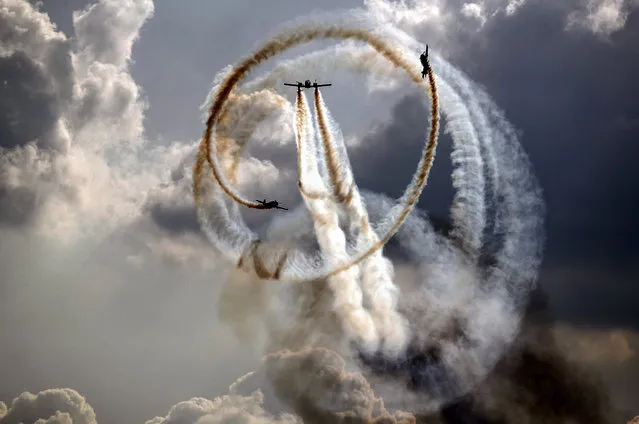 An aerobatic team “First Flight” piloting Yak-52 and Yak-54 aircrafts performs during the MAKS-2019 International Aviation and Space Salon in Zhukovsky outside Moscow, Russia, 01 September 2019. The Salon runs from 27 August to 01 September. (Photo by Sergei Ilnitsky/EPA/EFE/Rex Features/Shutterstock)