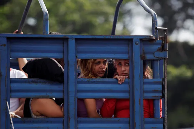 Part of 120 members and associates of the Mara Salvatrucha (MS-13) gang are transported in a truck after being arrested in a raid operation in San Salvador, El Salvador July 28, 2016. (Photo by Jose Cabezas/Reuters)