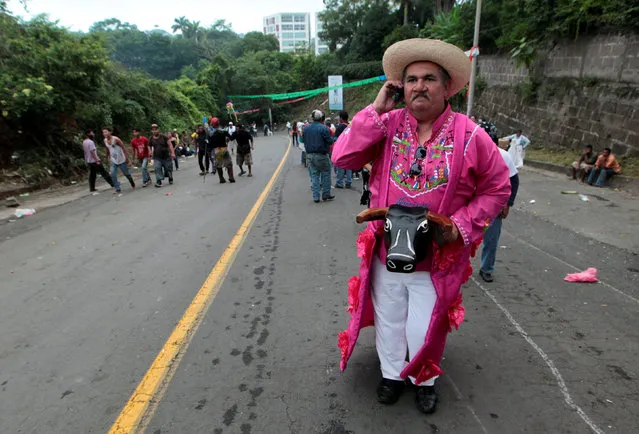 A man wearing a traditional costume takes part in the festivities honouring the capital's patron saint Santo Domingo de Guzman in Managua, Nicaragua August 1, 2016. (Photo by Oswaldo Rivas/Reuters)