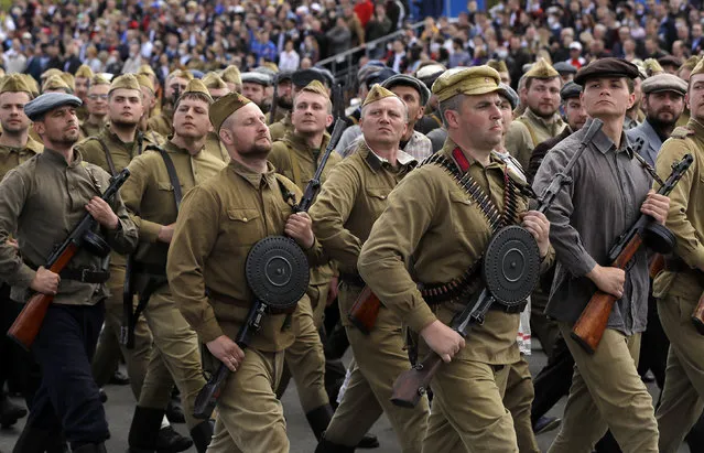 People dressed in old uniforms march during the Victory Day military parade that marked the 75th anniversary of the allied victory over Nazi Germany, in Minsk, Belarus, Saturday, May 9, 2020. (Photo by Sergei Grits/AP Photo)