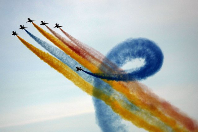 Frecce Tricolori (Tricolor Arrows), the Italian Air Force aerobatic display team, perform during the opening day of the Dubai Air Show, United Arab Emirates, Monday, November 13, 2023. (Photo by Kamran Jebreili/AP Photo)
