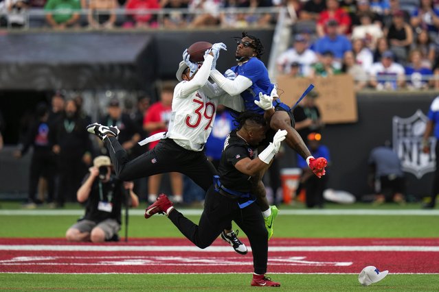 NFC wide receiver Malik Nabers, of the New York Giants, right, catches a pass while defended by AFC safety Minkah Fitzpatrick (39), of the Pittsburgh Steelers, during the flag football event at the NFL Pro Bowl, Sunday, February 2, 2025, in Orlando. (Photo by Chris O'Meara/AP Photo)