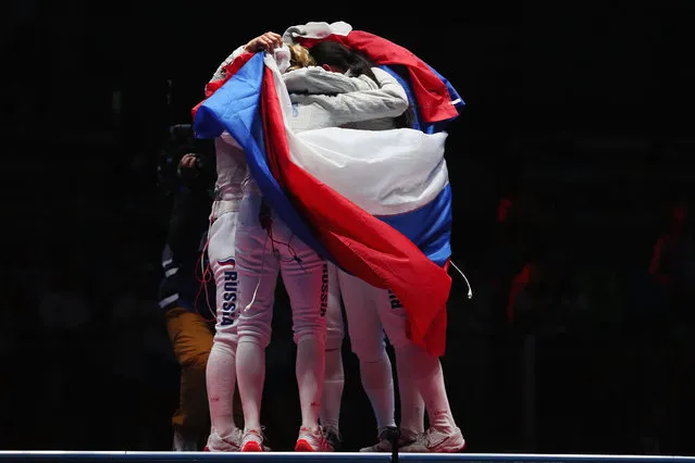 Russia celebrates winning gold after the Women's Sabre Team gold medal match between Russia and Ukraine on Day 8 of the Rio 2016 Olympic Games at Carioca Arena 3 on August 13, 2016 in Rio de Janeiro, Brazil. (Photo by Tom Pennington/Getty Images)