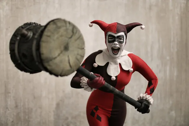 Comic Con attendee Alyssa King poses as Harlequin during the 2014 New York Comic Con at Jacob Javitz Center on October 10, 2014 in New York City. (Photo by Neilson Barnard/Getty Images)