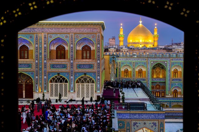 Shiites break the fast during the Islamic holy month of Ramadan in the Imam Ali shrine in Najaf, Iraq, Saturday, March 15, 2025. (Photo by Anmar Khalil/AP Photo)