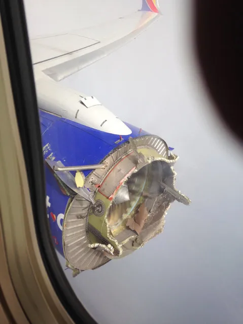 This Saturday, August 27, 2016, file photo shows an engine through a window of a Southwest Airlines flight. The flight from New Orleans bound for Orlando, Fla., diverted to Pensacola, Fla., after the pilot detected something had gone wrong with the engine. On Monday, September 12, the National Transportation Safety Board said that an engine fan blade on the jet broke off and the stub of the blade shows signs of metal fatigue. The plane made a safe emergency landing after shrapnel from the broken engine hit the fuselage. (Photo by Jeremy Martin via AP Photo)