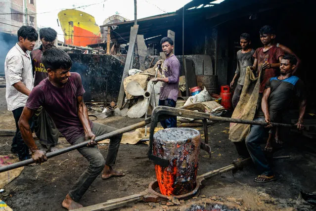 Labourers of all ages work in Dhaka, Bangladesh  on September 2, 2020 in shipbuilding in dangerous conditions with minimum safety guards, which often leads to accidents. (Photo by Piyas Biswas/Sopa Images/Rex Features/Shutterstock)