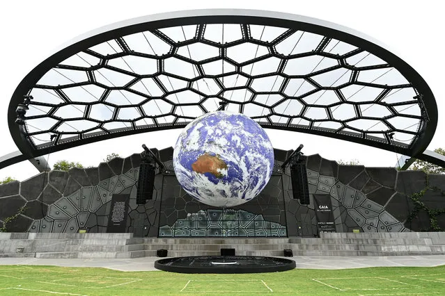 Art installation “Gaia” is seen on display at HOTA on September 30, 2020 in Gold Coast, Australia. The work by UK artist Luke Jerram measures seven metres in diameter, with internal lighting combining 120dpi detailed NASA imagery of the Earth. The spherical sculpture is accompanied by a specially made surround sound composition by composer Dan Jones. (Photo by Quinn Rooney/Getty Images)