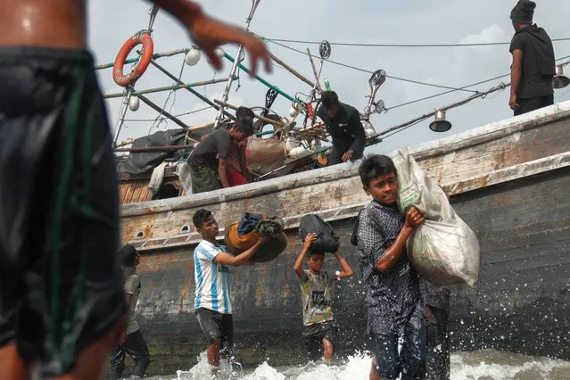 About 50 Rohingya, adults and children are stranded on Lampanah beach, in Aceh Besar on 16 February 2023. (Photo by Ayu Majiah/AFP Photo)