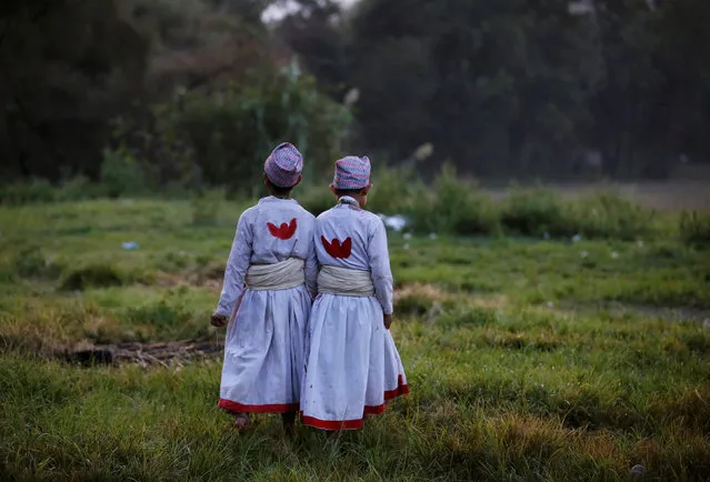 Young priests walk on a field during “Dashain”, a Hindu religious festival in Bhaktapur, Nepal October 11, 2016. (Photo by Navesh Chitrakar/Reuters)