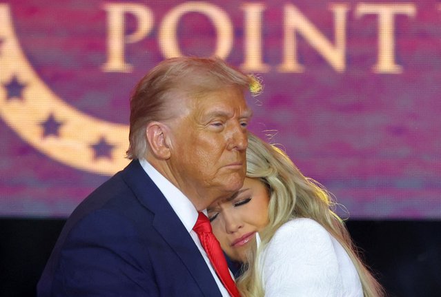 U.S. President Donald Trump embraces Erika Kirk, during a memorial service for her husband, slain conservative commentator Charlie Kirk, at State Farm Stadium in Arizona, U.S., September 21, 2025. (Photo by Carlos Barria/Reuters)