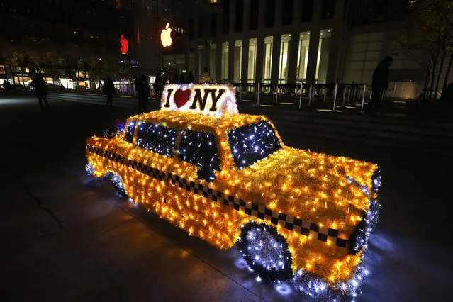A life size NY taxi Christmas ornament is seen on Fifth Avenue on December 2, 2020 in New York City. Many holiday events have been canceled or adjusted with additional safety measures due to the ongoing coronavirus (COVID-19) pandemic. (Photo by John Lamparski/Getty Images)