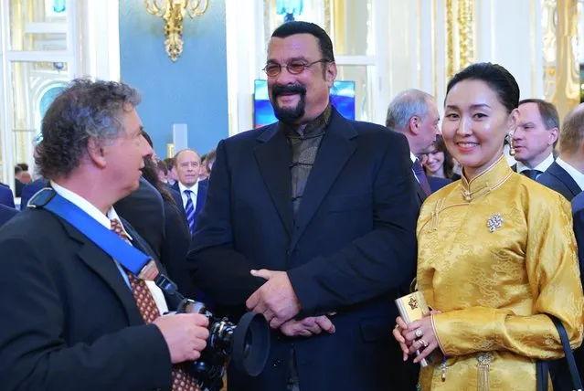 Hollywood actor Steven Seagal (C) with his wife Erdenetuya arrives for an inauguration of Vladimir Putin as President of Russia at St Andrew' s Hall of the Moscow Kremlin in Moscow, Russia on May 7, 2018. (Photo by Alexei Druzhinin/Russian Presidential Press and Information Office/TASS)