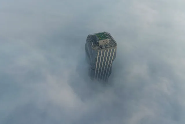 An aerial view of the whole city covered by heavy fog in Lianyungang city, east China's Jiangsu province, 28 December 2020. (Photo by Rex Features/Shutterstock)