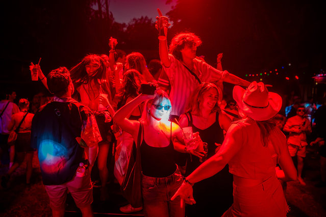 Festival-goers enjoy a concert during the 30th Sziget (Island) Festival on Shipyard Island, northern Budapest, Hungary, 07 August 2024. This year's event runs from 07 to 12 August. (Photo by Zoltán Balogh/EPA/EFE)