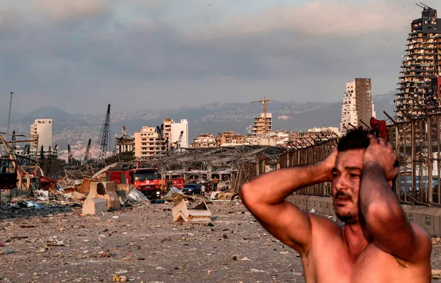A man reacts at the scene of an explosion at the port in Lebanon's capital Beirut on August 4, 2020. (Photo by Ibrahim Amro/AFP Photo)