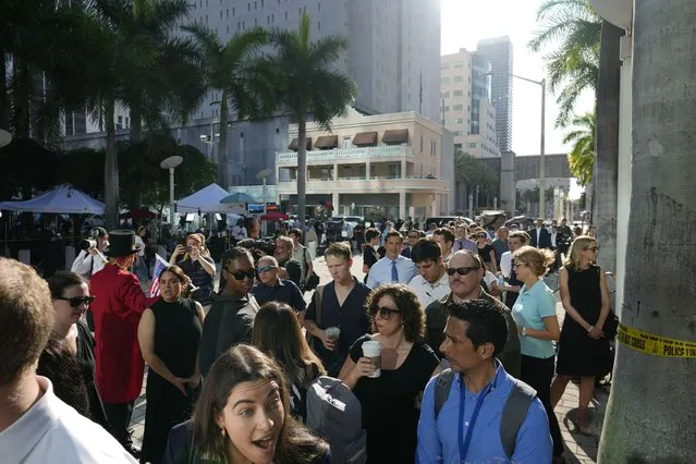 Journalists line up to be admitted inside the Wilkie D. Ferguson Jr. U.S. Courthouse, Tuesday, June 13, 2023, in Miami. Former President Donald Trump is making a federal court appearance on dozens of felony charges accusing him of illegally hoarding classified documents and thwarting the Justice Department's efforts to get the records back. (Photo by Rebecca Blackwell/AP Photo)