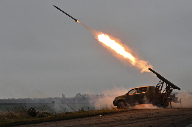 Members of the artillery unit of the special rifle battalion of Zaporizhzhia region police fire a small multiple launch rocket system (MLRS) toward Russian troops in a front line, in Zaporizhzhia region, Ukraine, on December 25, 2024. (Photo by Reuters/Stringer)