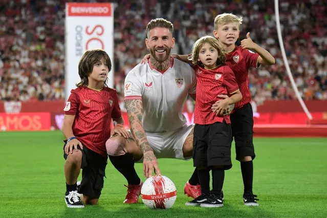 Sevilla's newly-signed Spanish defender Sergio Ramos' poses with his sons during his official presentation at the Ramon Sanchez Pizjuan stadium in Seville, on September 6, 2023. Veteran former Spain defender Sergio Ramos returned to his home-town club Sevilla after 18 years away. (Photo by Cristina Quicler/AFP Photo)