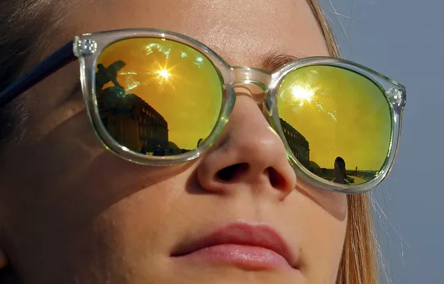 A woman watches a partial solar eclipse in Budapest March 20, 2015. (Photo by Laszlo Balogh/Reuters)