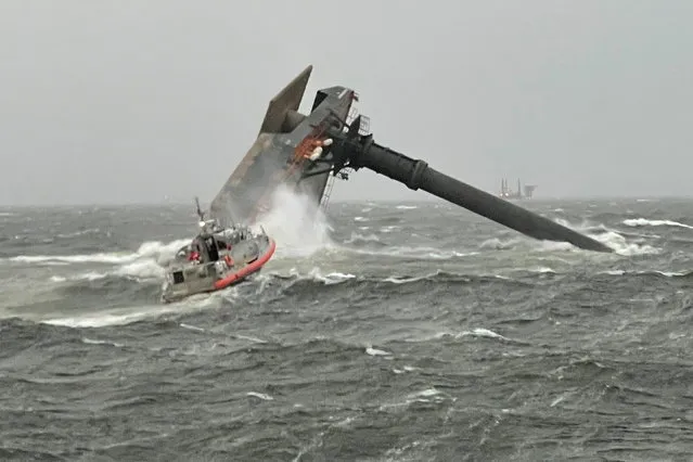 A Coast Guard Station Grand Isle boatcrew heads toward a capsized 175-foot commerical lift boat while searching for people in the water 8 miles (about 13 km) south of Grand Isle, Louisiana, U.S. April 13, 2021. (Photo by U.S. Coast Guard/Handout via Reuters)
