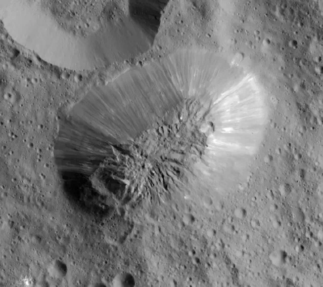 This image provided by NASA, shows an inactive volcano on the surface of Ceres, the largest object in the asteroid belt between Mars and Jupiter. Scientists said the volcano on the dwarf planet Ceres is about half as tall as Mount Everest. (Photo by NASA/JPL-Caltech/UCLA/MPS/DLR/IDA via AP Photo)