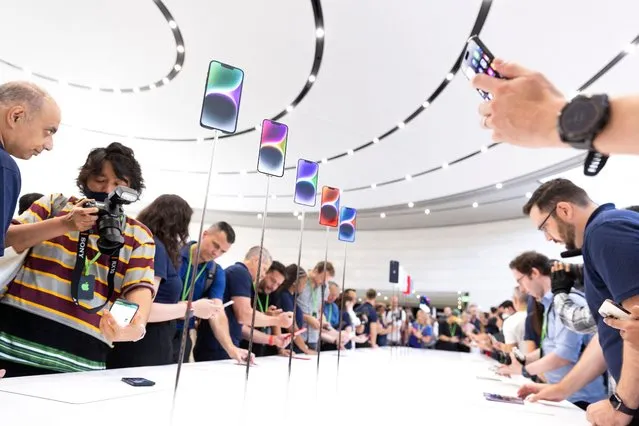 The new iPhone 14 and 14 Plus are on display at an Apple event at Apple Park in Cupertino, California on September 7, 2022. Apple unveiled several new products including a new iPhone 14 and 14 Pro, three Apple watches and new AirPods Pros during the event. (Photo by Brittany Hosea-Small/AFP Photo)
