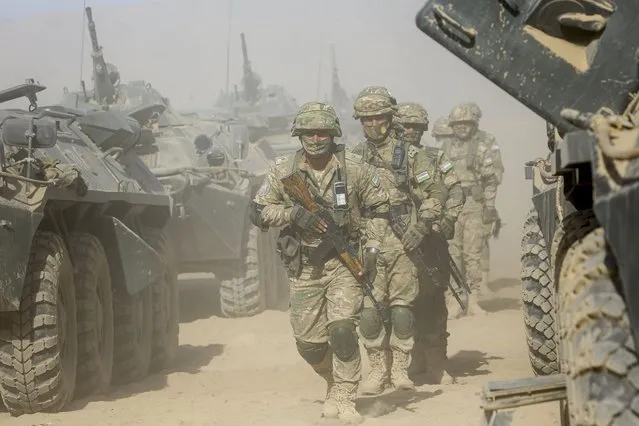 Uzbekistan's troops attend a joint military drills together with Russia and Tajikistan at Harb-Maidon firing range about 20 kilometers (about 12 miles) north of the Tajik border with Afghanistan, in Tajikistan, Tuesday, August 10, 2021. (Photo by Didor Sadulloev/AP Photo)