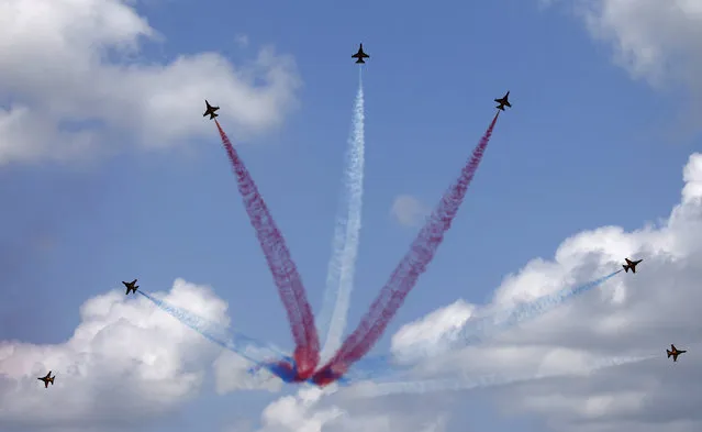 South Korea's Black Eagles perform a manoeuvre during an aerial display on the opening day of the Singapore Airshow at Changi Exhibition Center February 16, 2016. (Photo by Edgar Su/Reuters)