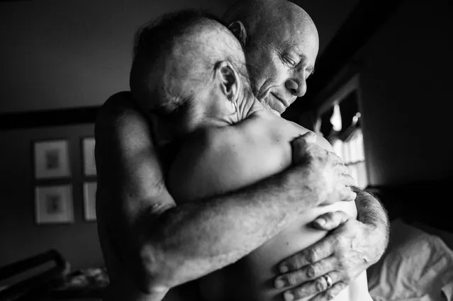 “A Life in Death”. Long-Term Projects, second prize stories. Nancy Borowick, USA. Howie and Laurel Borowick embrace in the bedroom of their home. In their 34-year marriage, they were diagnosed with stage-4 cancer at the same time, March 8, 2013. A daughter photographs her own parents who were in parallel treatment for stage-four cancer, side by side. The project looks at love, life, and living, in the face of death. It honors their memory by focusing on their strength and love, both individually and together, and shares the story of their final chapters, within a year of each other. (Photo by Nancy Borowick/World Press Photo Contest)