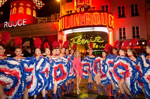 Celine Dion poses with dancers during her visit to The Moulin Rouge on January 24, 2019 in Paris, France. (Photo by Kristy Sparow/Getty Images)