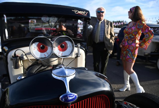 Motoring enthusiasts attend the Goodwood Revival, a three-day historic car racing festival in Goodwood, Chichester, southern Britain, September 17, 2021. (Photo by Toby Melville/Reuters)