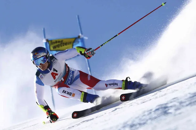 Switzerland's Marco Odermatt speeds down the course during an alpine ski, men's World Cup giant slalom, in Soelden, Austria, Sunday, October 24, 2021. (Photo by Marco Trovati/AP Photo)