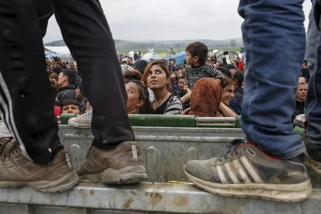 Migrants and refugees gather to listen to Nadia Murad Basee Taha (not pictured), an Iraqi woman of the Yazidi faith who was abducted and held by the Islamic State for three months, at the Greek-Macedonian border near the village of Idomeni, Greece, April 3, 2016. (Photo by Marko Djurica/Reuters)