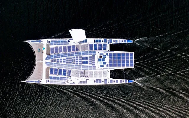 An aerial picture taken on May 28, 2019 shows the self-energy producing multihull “Energy Observer” sailing off the coast of the Swedish capital, Stockholm. The high-tech catamaran, part of a project aimed at finding new solutions in favour of energy transition, is on a trip around the world during six years – from 2017 to 2022 – with 50 countries expected to be visited along the way. (Photo by Jonathan Nackstrand/AFP Photo)